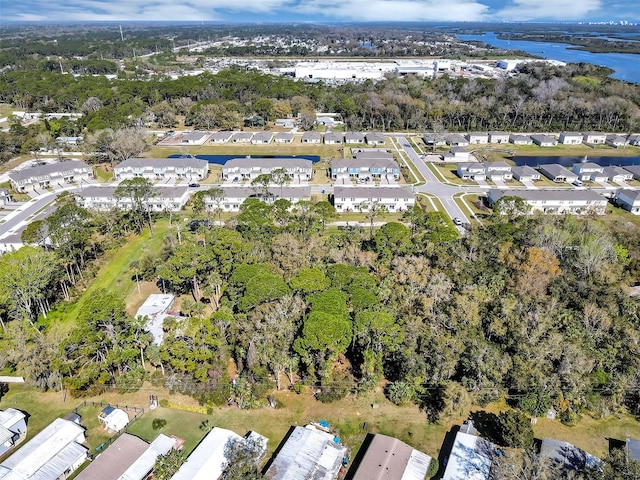 birds eye view of property with a residential view and a water view