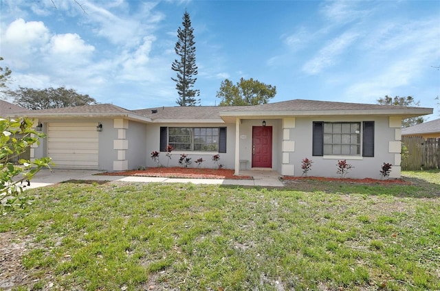 ranch-style house with a garage, a front yard, fence, and stucco siding