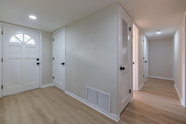 entrance foyer with baseboards, recessed lighting, visible vents, and light wood-style floors