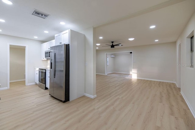 kitchen featuring recessed lighting, visible vents, baseboards, light wood-style floors, and appliances with stainless steel finishes