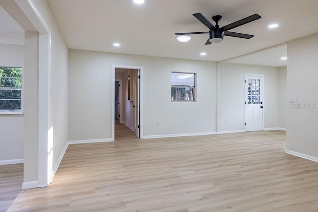 unfurnished room with recessed lighting, ceiling fan, light wood-style flooring, and baseboards