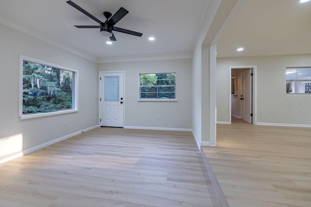 entryway with light wood finished floors, baseboards, ornamental molding, and recessed lighting