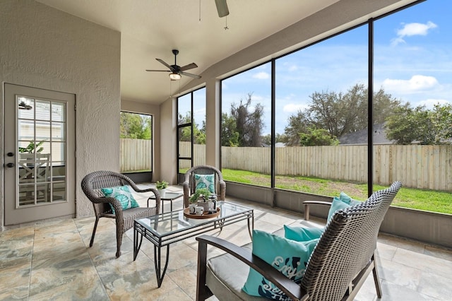 sunroom / solarium with ceiling fan