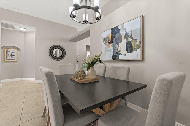 dining room with visible vents, a chandelier, baseboards, and light tile patterned flooring