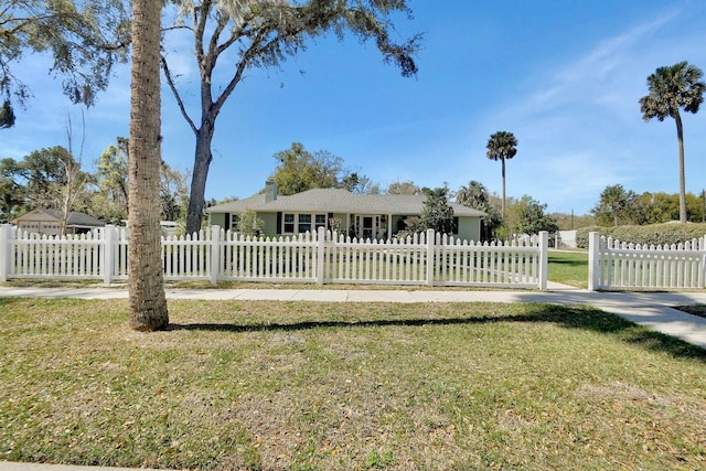 view of front of house with a front lawn and a fenced front yard