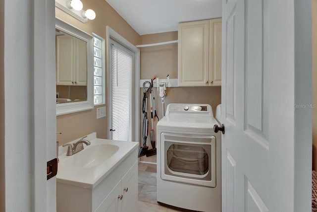 clothes washing area with a sink and cabinet space