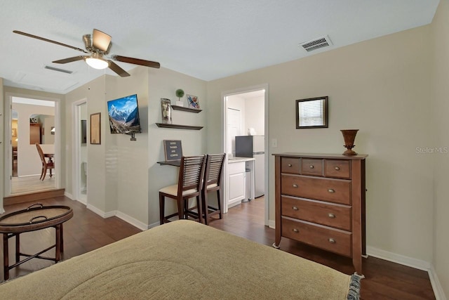 bedroom featuring dark wood-type flooring, visible vents, and baseboards