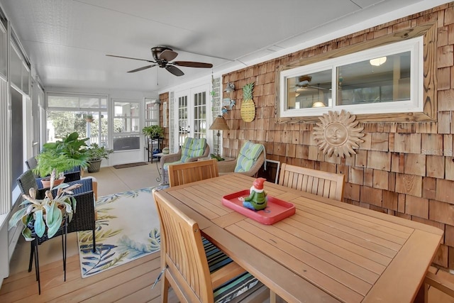 sunroom featuring ceiling fan