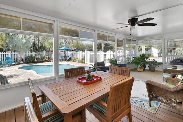 sunroom with a ceiling fan