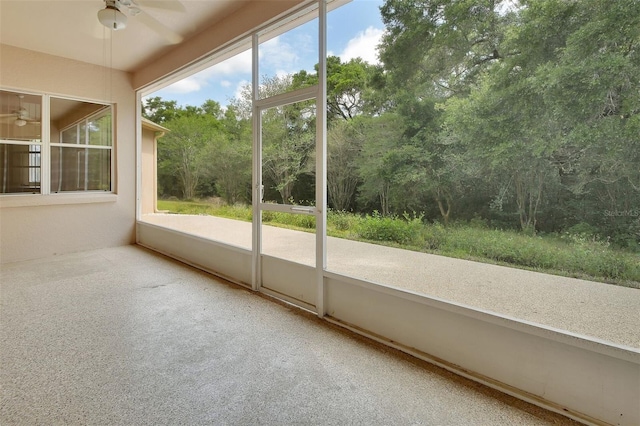 1491 W Silver Hammock, Deland, FL 32720 - unfurnished sunroom with ceiling fan and view of wooded area