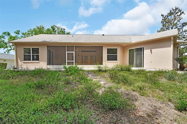 1491 W Silver Hammock, Deland, FL 32720 - rear view of house featuring a sunroom and stucco siding