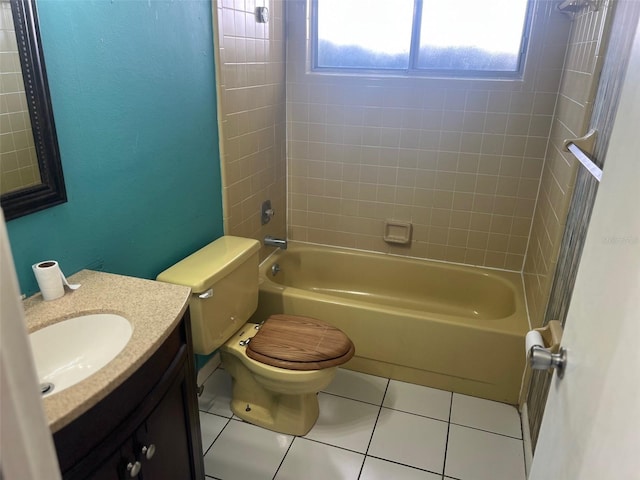 bathroom with tile patterned flooring, bathtub / shower combination, vanity, and toilet