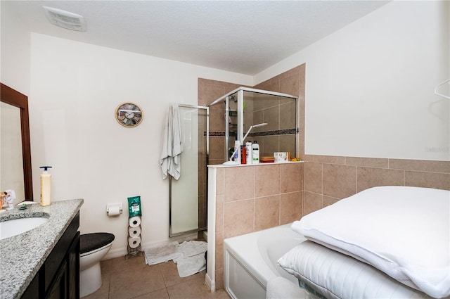 full bathroom featuring a garden tub, visible vents, toilet, a shower stall, and tile patterned flooring