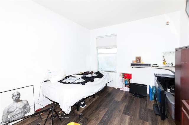 bedroom with wood finished floors