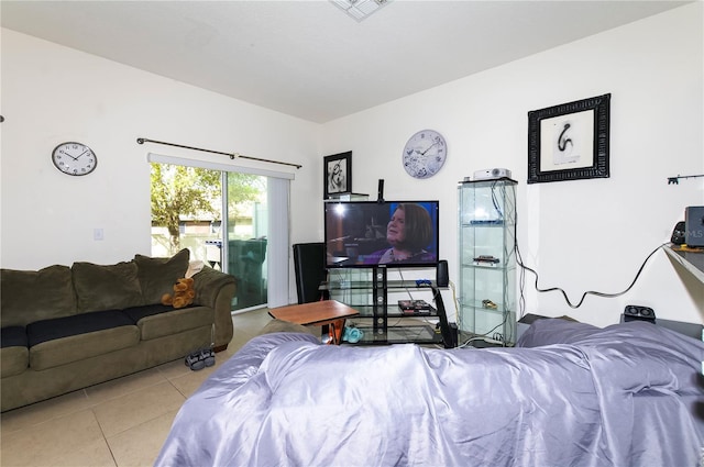 living room featuring visible vents and light tile patterned floors