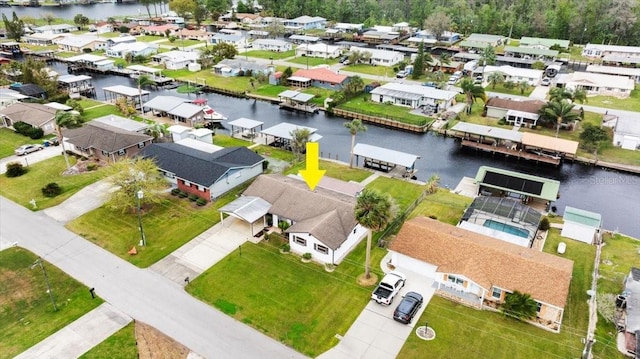 drone / aerial view featuring a water view and a residential view