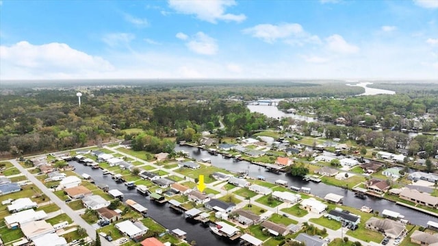 birds eye view of property with a water view and a residential view