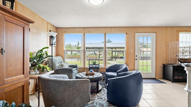 living room with light tile patterned floors and a textured ceiling