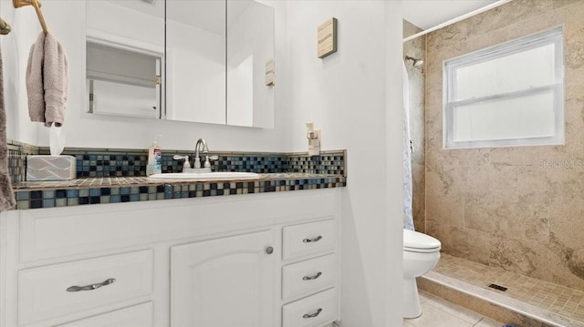 full bath with vanity, tile patterned flooring, a shower stall, and toilet