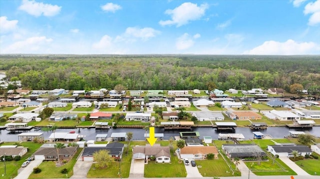 birds eye view of property with a water view, a forest view, and a residential view