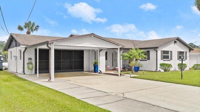 ranch-style house with an attached garage, a front lawn, concrete driveway, and roof with shingles