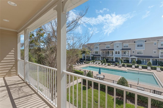 balcony with a residential view and a patio