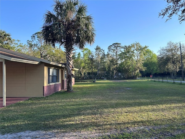 view of yard featuring fence