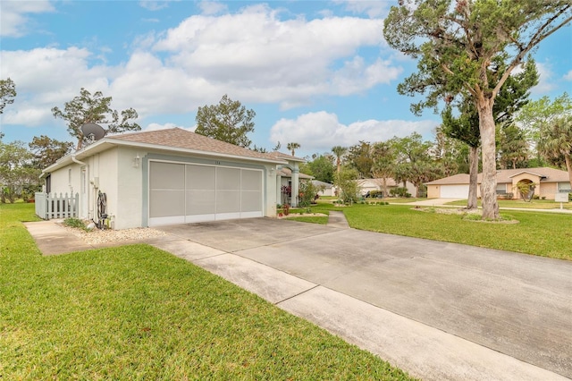 exterior space featuring stucco siding, driveway, roof with shingles, an attached garage, and a front yard