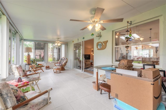 interior space featuring a ceiling fan and a sunroom