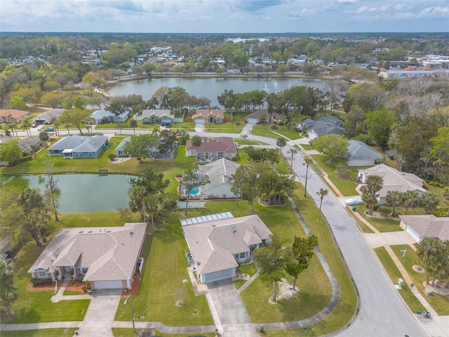 birds eye view of property with a residential view and a water view