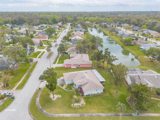 drone / aerial view with a residential view and a water view