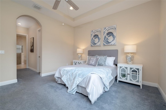 carpeted bedroom with baseboards, visible vents, arched walkways, and recessed lighting