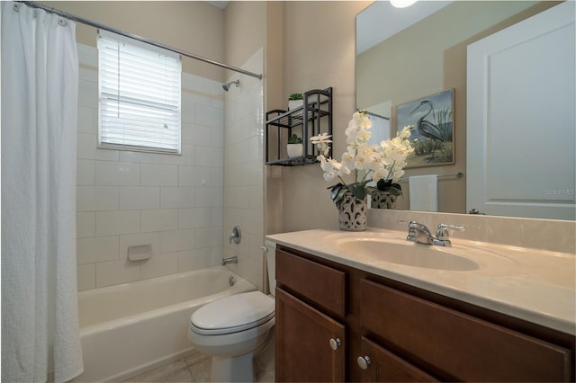 full bath featuring tile patterned flooring, shower / tub combo with curtain, vanity, and toilet