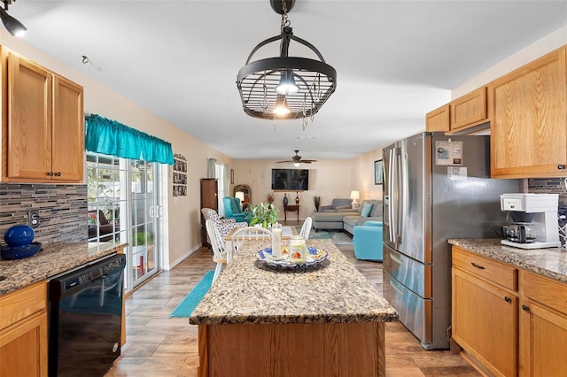 kitchen featuring dishwasher, a ceiling fan, open floor plan, and backsplash