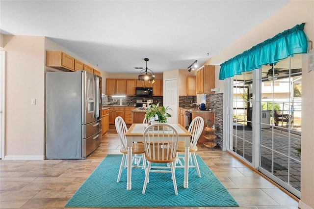 dining area featuring baseboards