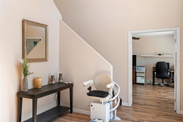 interior space featuring wood finished floors and baseboards