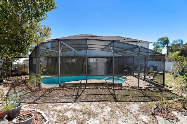 view of pool with a fenced in pool, a lanai, a patio area, and fence