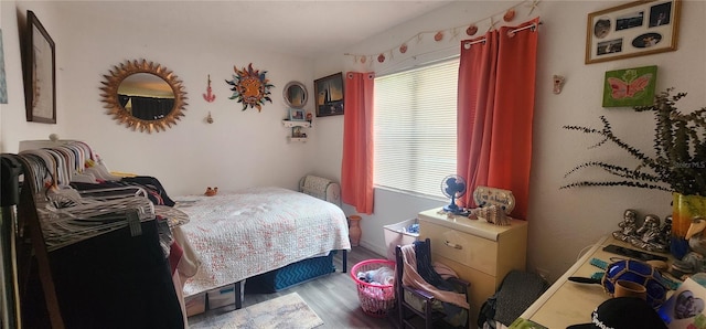 bedroom featuring wood finished floors