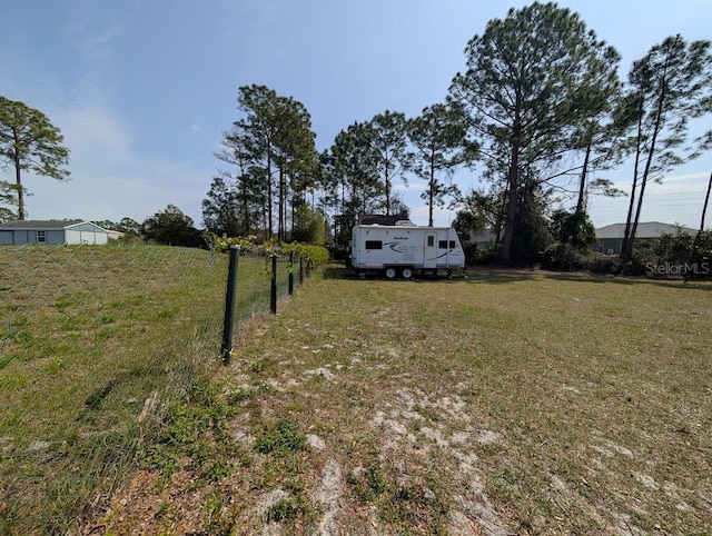 view of yard featuring fence