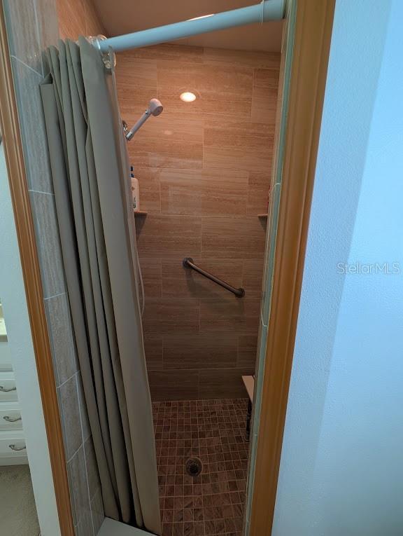 bathroom with a shower stall