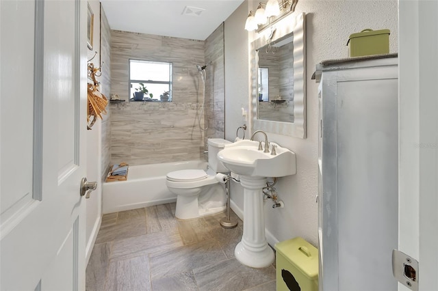 full bathroom with toilet, shower / tub combination, and visible vents