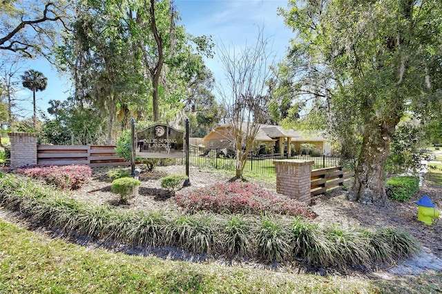 view of community featuring fence