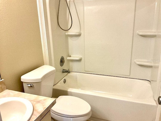 full bathroom with toilet, vanity, and tub / shower combination