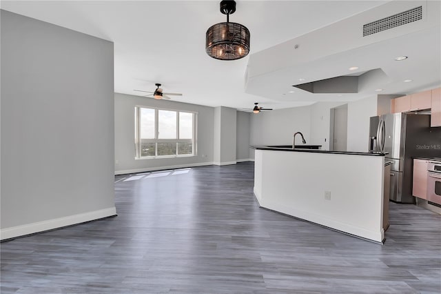 kitchen with visible vents, baseboards, dark countertops, and open floor plan