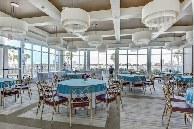 sunroom with beam ceiling, a healthy amount of sunlight, and coffered ceiling