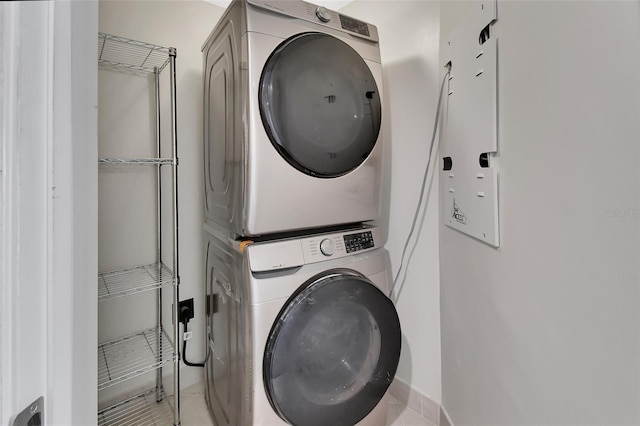 washroom featuring laundry area and stacked washer and clothes dryer