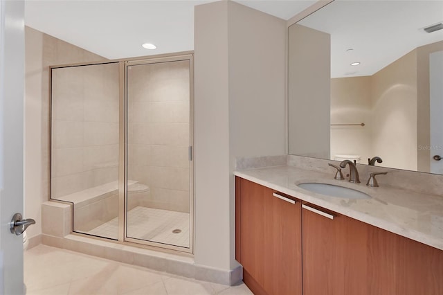 bathroom with tile patterned floors, visible vents, a stall shower, recessed lighting, and vanity