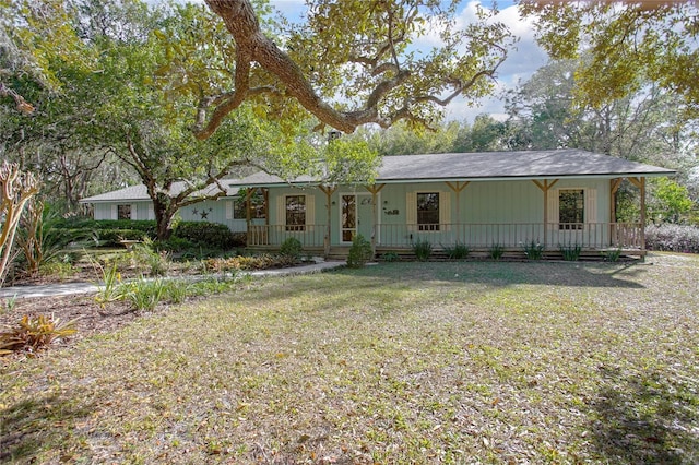 ranch-style house with a porch and a front lawn