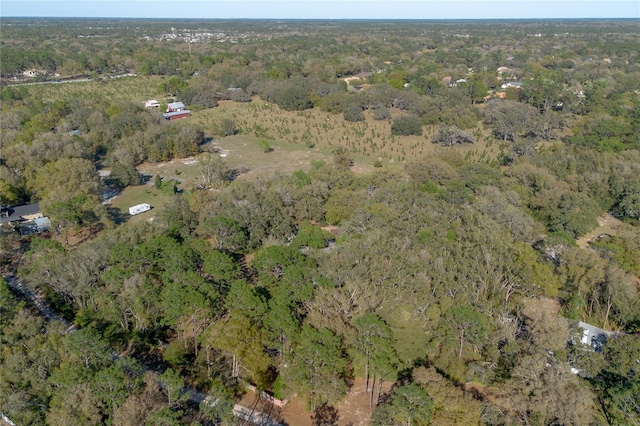 birds eye view of property with a wooded view