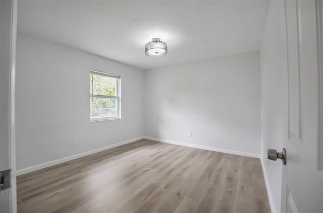 1986 Big Oak Dr, South Daytona, FL 32119 - unfurnished room featuring wood finished floors and baseboards